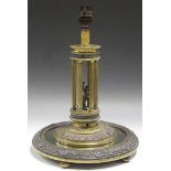 A mid-19th Century French gilt bronze and applied filigree table lamp, the colonnaded stem enclosing