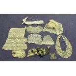 A collection of various lacework sections, borders, cuffs and collars.