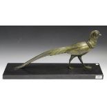 An Art Deco bronzed cast spelter model of a stylized pheasant, raised on a polished slate