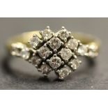 An 18ct gold and diamond cluster ring in a twist-over design, claw set with circular cut diamonds,