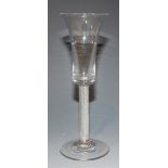 An ale glass, mid-18th Century, with waisted bell bowl, the multiple series airtwist stem on a