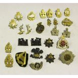 A collection of sixteen full dress officers' cap badges, including Royal Flying Corps with Gaunt
