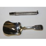 A Victorian Scottish silver Fiddle pattern caddy spoon of shovel form, the handle with engraved