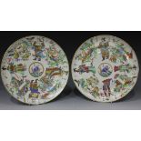 A pair of Chinese Canton famille rose export porcelain plates, mid-19th Century, each enamelled with