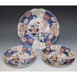 A group of three Japanese Imari porcelain graduated dishes, 18th Century, each of lobed form,