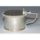 A George III silver mustard of cylindrical form with hinge lid and gadrooned rim, London 1810 by