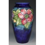 A Moorcroft pottery vase, circa 1949-1983, of elongated ovoid form, decorated with Clematis design