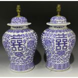 A pair of Chinese blue and white porcelain vases and covers, 20th Century, each baluster body