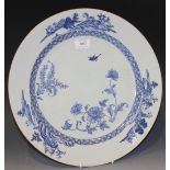 A Chinese blue and white export porcelain circular dish, Yongzheng period, painted with a bird