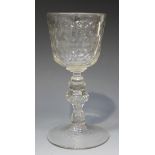 A Continental glass goblet, mid-18th Century, the faceted 'U' shaped bowl on a teared and faceted