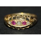 An 18ct gold, ruby and rose diamond set five stone ring in a boat shape setting, Birmingham 1914,
