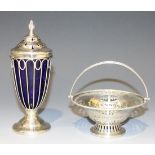 A George V silver sugar caster, the pierced domed cover with reeded finial above a tapering wirework