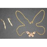 A 9ct gold and diamond set necklace, the front with a butterfly motif, mounted with circular cut