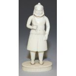 An Indian ivory figure, 19th Century, probably Bengali, modelled as a turbaned gentleman standing on