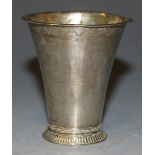 An 18th Century Swedish silver beaker of tapering form, the circular foot with milled border,