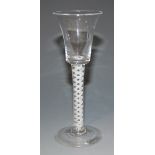 A wine glass, mid-18th Century, with waisted bucket bowl, the opaque twist stem, with a pair of