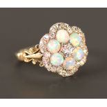 A gold, diamond and opal set shaped hexagonal ring, mounted with the principal cushion shaped