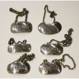 A group of six silver decanter labels, comprising 'Hollands', London 1811 by John Reily, 'Sherry',