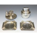 A pair of George V silver ashtrays, Birmingham 1917, a silver Colibri table lighter and a sterling