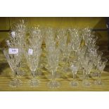 A part suite of Webb glasses, each with a tapering bowl cut with oval facet decoration, on a
