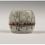 A Daum Nancy enamelled cameo glass winter landscape vase, circa 1905, of oval form, decorated with a