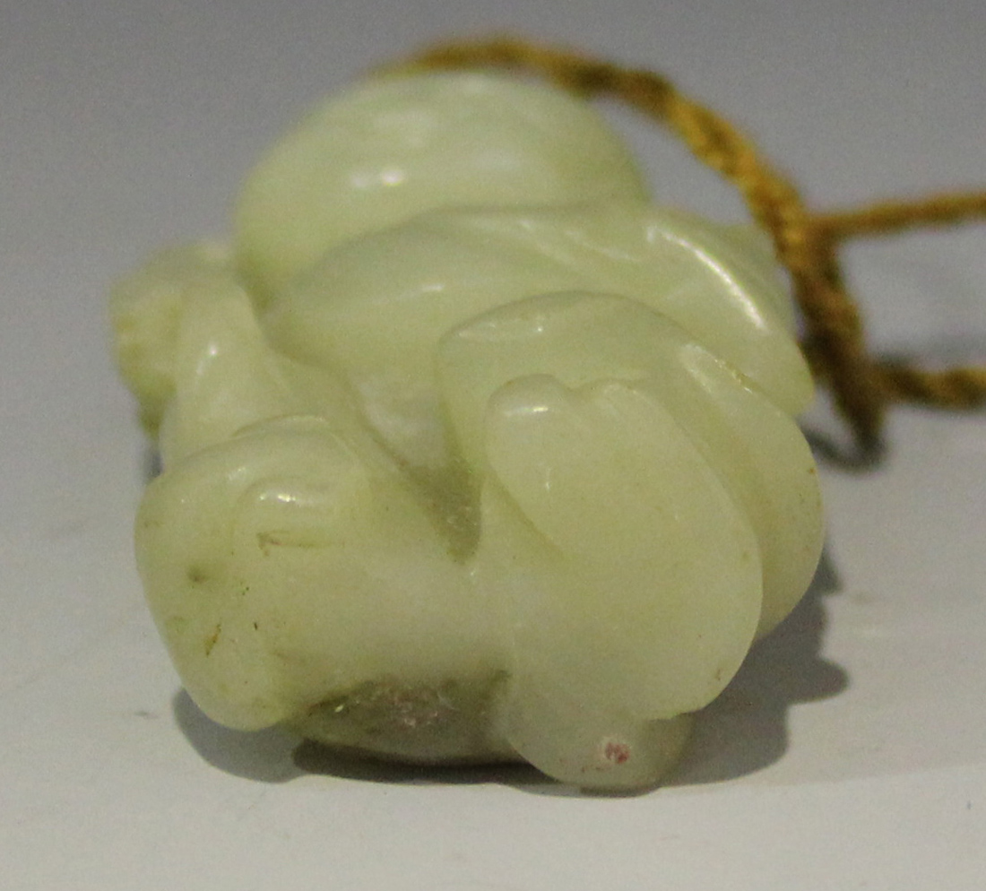 A Chinese carved pale celadon jade pendant of Lui Hai, Qing dynasty, modelled with a string of - Image 5 of 5