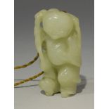 A Chinese carved pale celadon jade pendant of Lui Hai, Qing dynasty, modelled with a string of