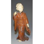 A Japanese boxwood and ivory okimono carving, Meiji period, modelled as a lady wearing a long