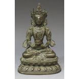 A Sino-Tibetan brown patinated bronze figure of Amitayus, probably late Qing dynasty, modelled