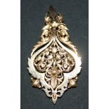 A French gold pendant brooch, pierced and engraved in a floral foliate and scrolling design,