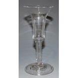 A wine glass, mid-18th Century, with bell bowl on a plain stem and fold-over foot, height approx