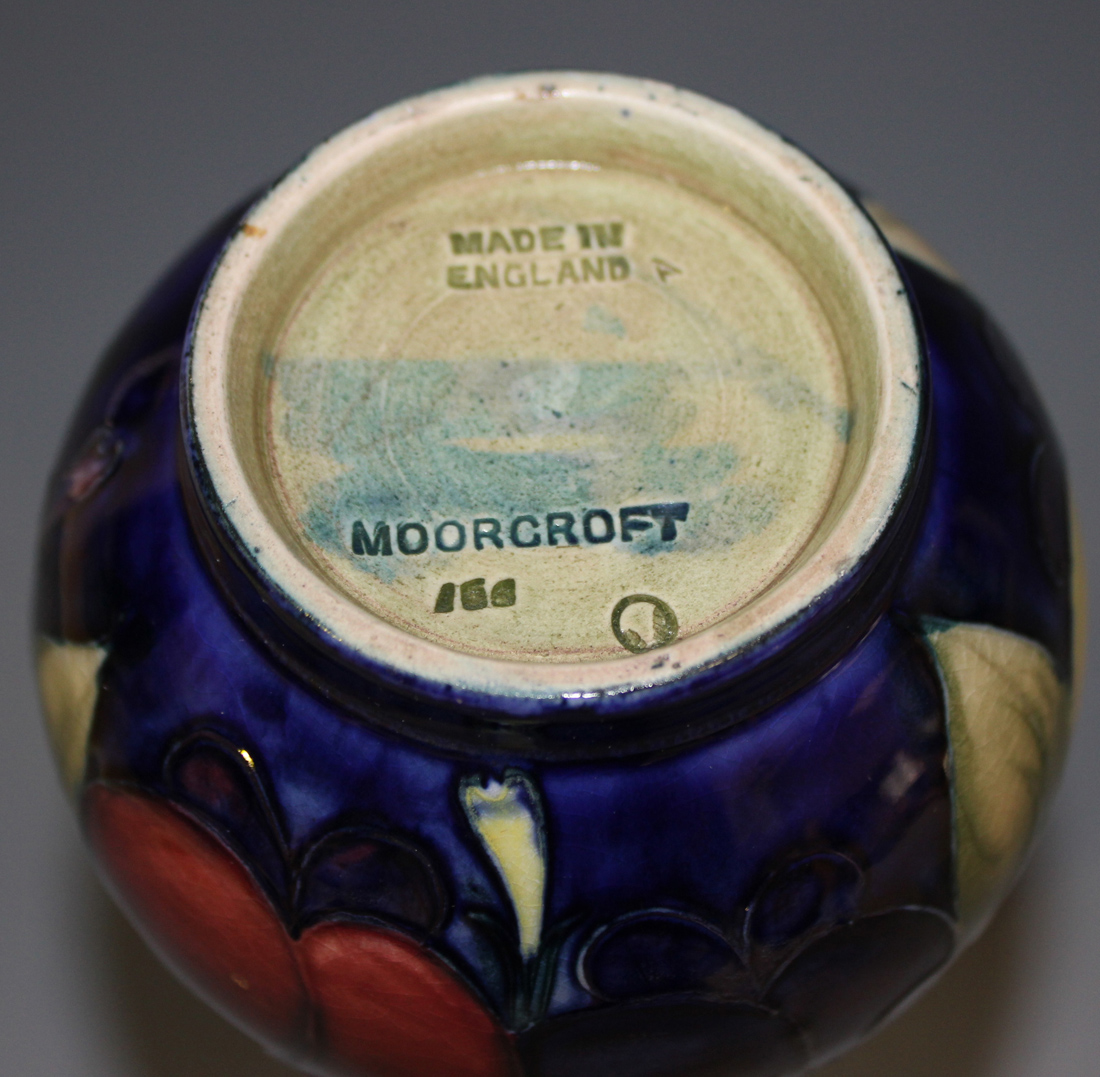 A Moorcroft pottery vase, circa 1920s, the narrow neck and bulbous body decorated with Wisteria - Image 2 of 2