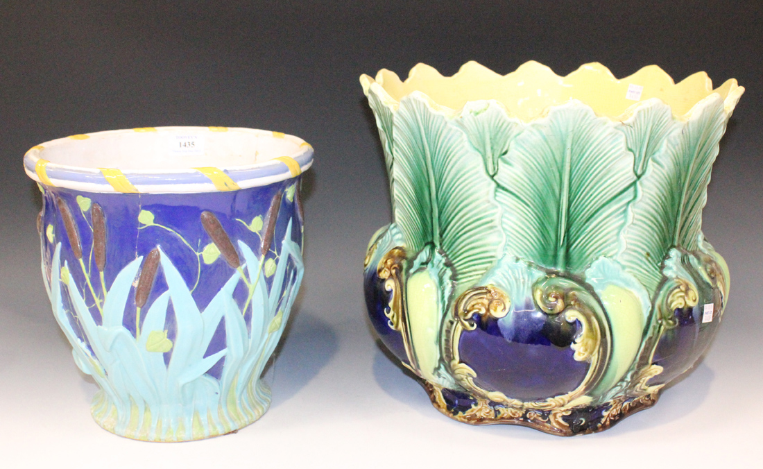 A Majolica jardinière, late 19th Century, moulded in relief with bulrushes and reeds on a blue