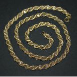 An 18ct gold, two tone ropetwist and oval link necklace on a gold boltring clasp, length approx