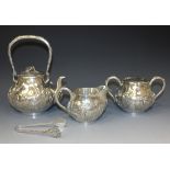 An early 20th Century Japanese silver four piece tea set, by Takeuchi & Co, of circular low