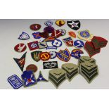 A small collection of U.S. cap and trade badges, including U.S. Army Recruiter, U.S.A.F.