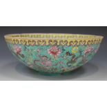 A Chinese eggshell porcelain bowl, 20th Century, decorated with dragons amidst flowers, pseudo