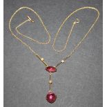 A gold, pink tourmaline and seed pearl necklace, mounted with the principal cabochon pink tourmaline