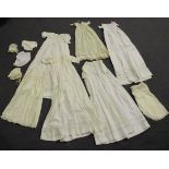 A group of mostly 19th Century white linen infants' clothing, including babies' dresses, christening