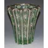 An Art Deco silver overlaid green glass vase by Pierre D'Avesn, of fluted flared shape, each