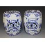 A pair of Chinese blue and white porcelain diminutive barrels, 20th Century, each decorated with