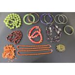 Two single row necklaces of coral beads, a quantity of branch corals, four further necklaces, a