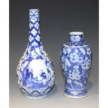 A Chinese blue and white porcelain bottle vase, mark of Kangxi but late 19th Century, painted with