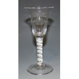 A wine glass, mid-18th Century, with bell shaped bowl, the double series opaque twist stem with