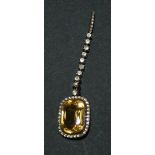 A citrine and colourless paste set pendant, the drop mounted with a cushion shaped citrine within