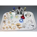 A collection of Swarovski crystal, including a fan, typewriter, egg timer, roundabout, yacht, bells,
