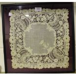 A 19th Century lacework panel embroidered with a crowned cypher within openwork foliate borders,