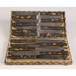 A set of twelve Japanese steel bladed knives with various kozuka, Meiji period, the handles