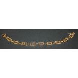 A 9ct gold bracelet in a pierced bar and lozenge shaped design, on a snap clasp, London 1975, length