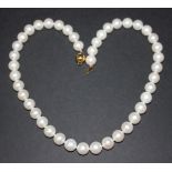 A single row necklace of graduated cultured pearls on a gold spherical clasp, detailed '14k', length